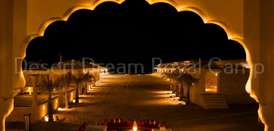 Lit archway at the camp at night
